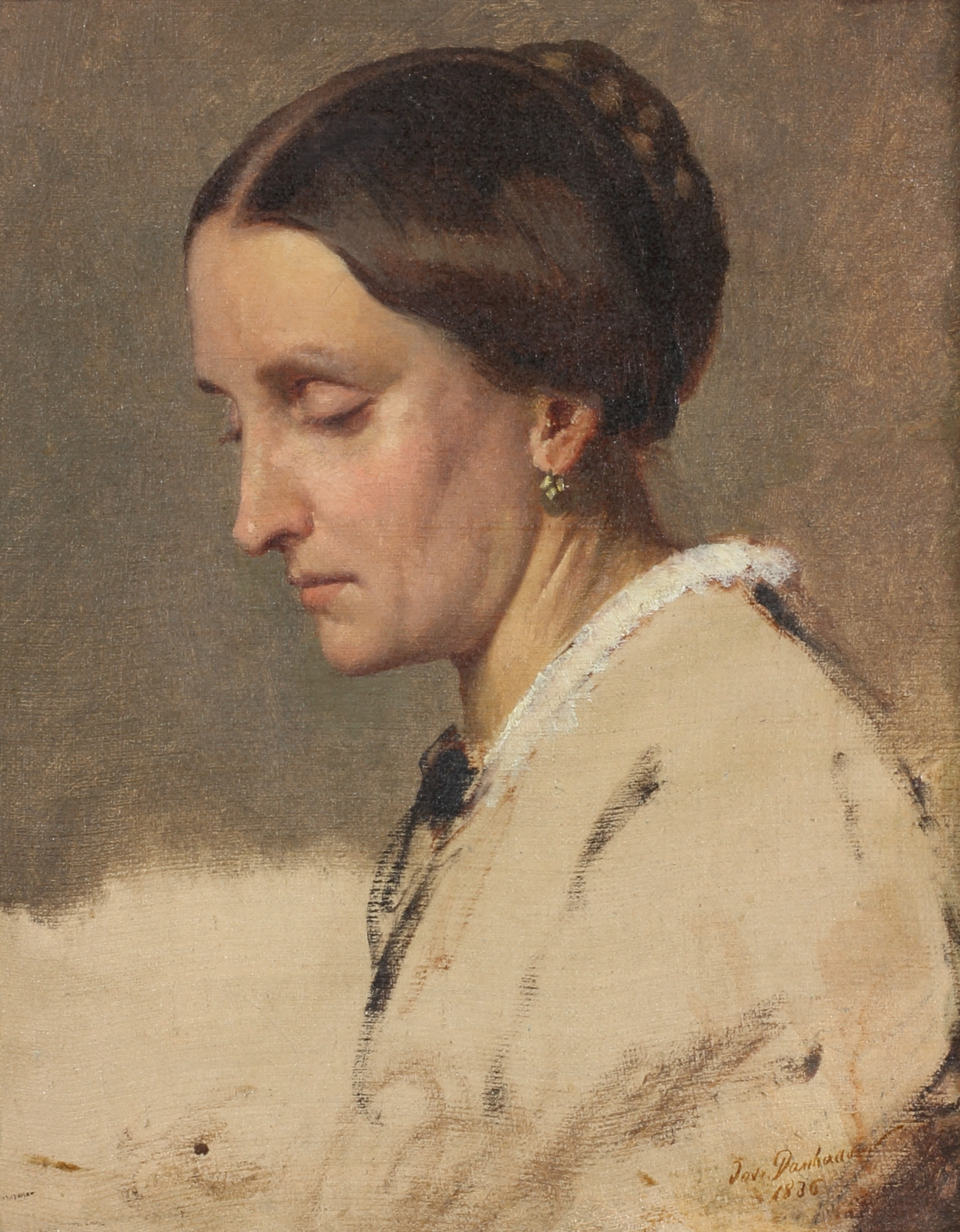 Portrait of a woman with her brown hair up, in a white outfit, who is looking down with eyes closed.